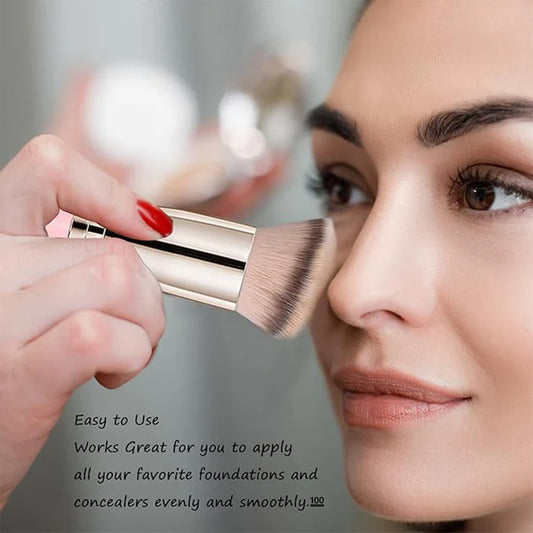 A person applying makeup with the Vynzo Precision Makeup Brush on a model's face for smooth blending.