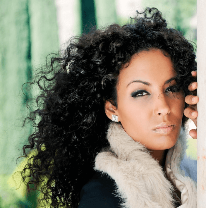 Model showcasing a polished look using Vital Adhesive for refined skin appearance.